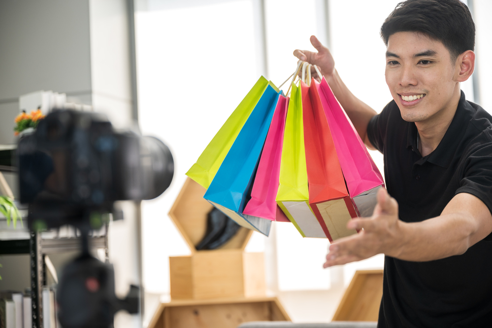 Young men are broadcasting online clothing sales